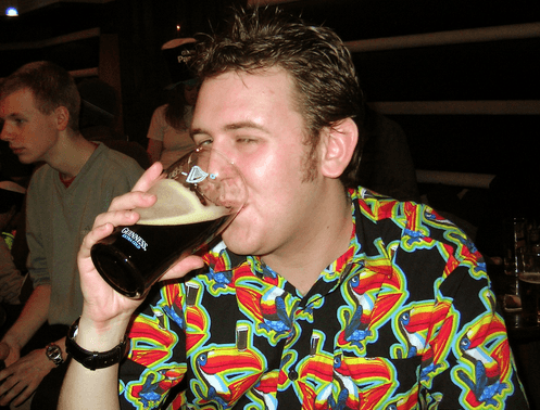 Student drinking a pint of guinness