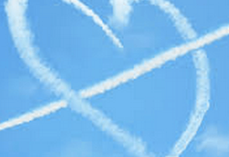 plane trails in the shape of a heart