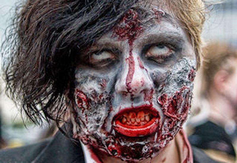 person in gory zombie makeup