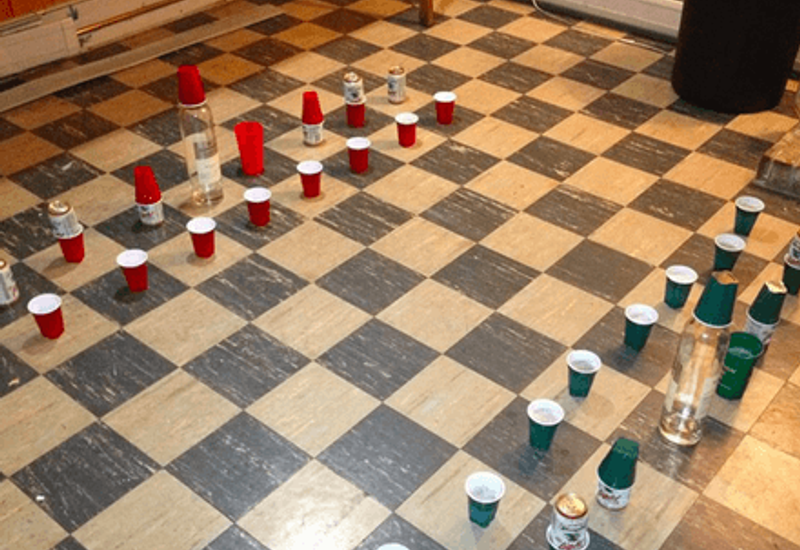 beer pong chess board on a kitchen floor
