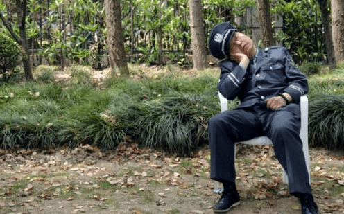 security guard asleep in a chair