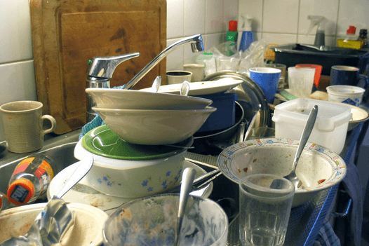 pile of dirty dishes in a sink