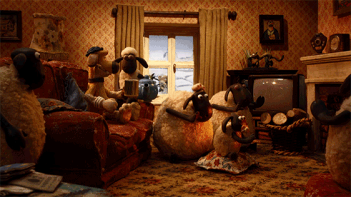 The extended Shaun the Sheep flock in the lounge drinking tea