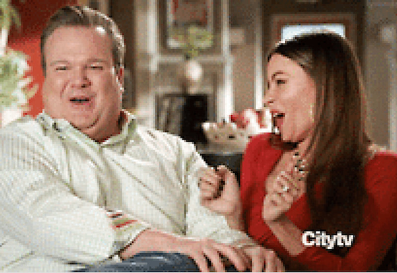 Frame from Modern Family of Cam and Gloria giggling